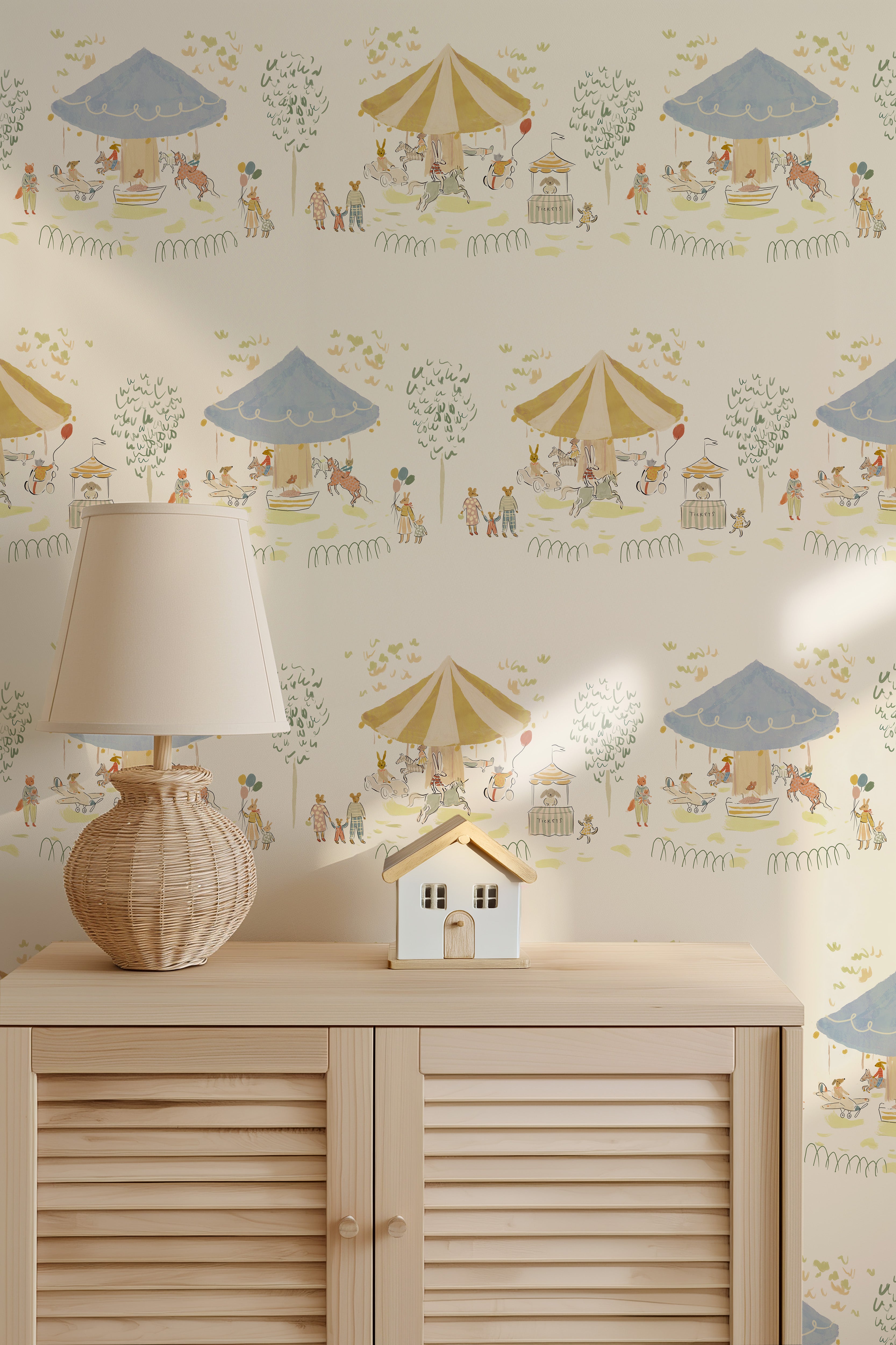 Decorative wallpaper with colorful umbrellas and small figures, featuring a lamp and house model on a wooden cabinet.