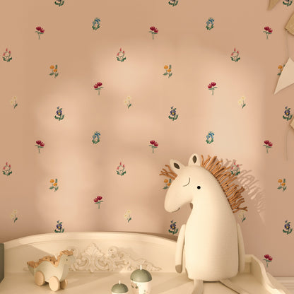 Children's room with a unicorn toy on a shelf against a patterned wall. Flower wallpaper is pink with all kinds of beautiful hand painted flowers, bluebells, tulips, ranunculus, pansy, daisy wallpaper