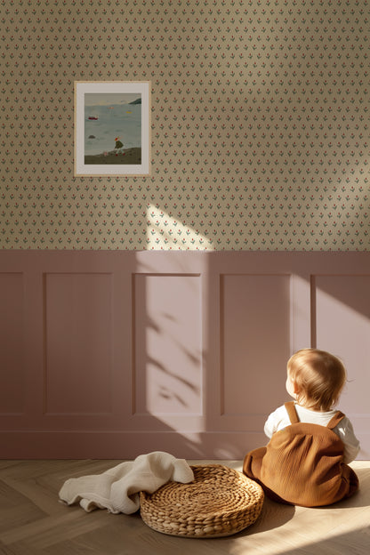 Child sitting on the floor in a room with patterned wallpaper and a framed picture.