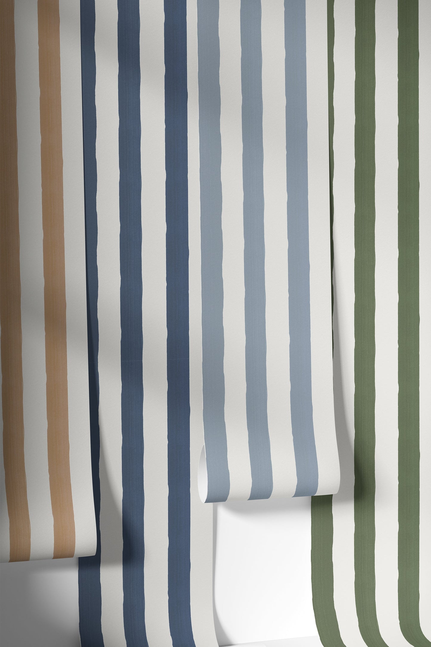 Rolls of hand painted striped wallpaper in various colors on a white background